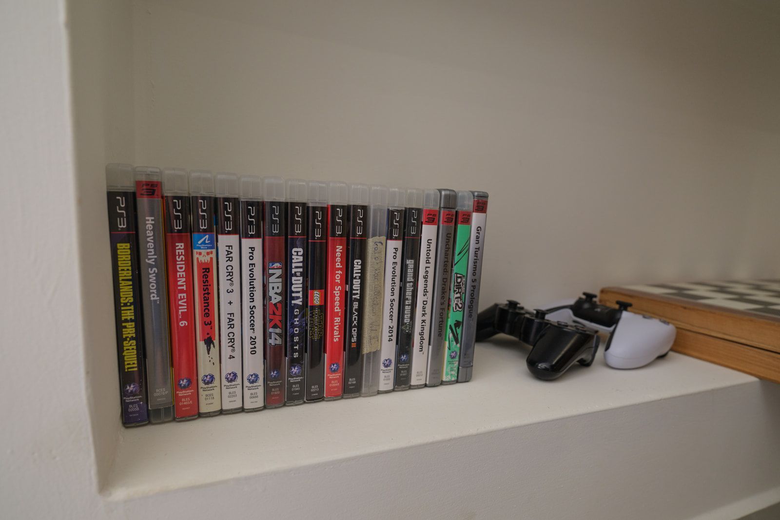 A shelf of games and consoles for quiet evenings in
