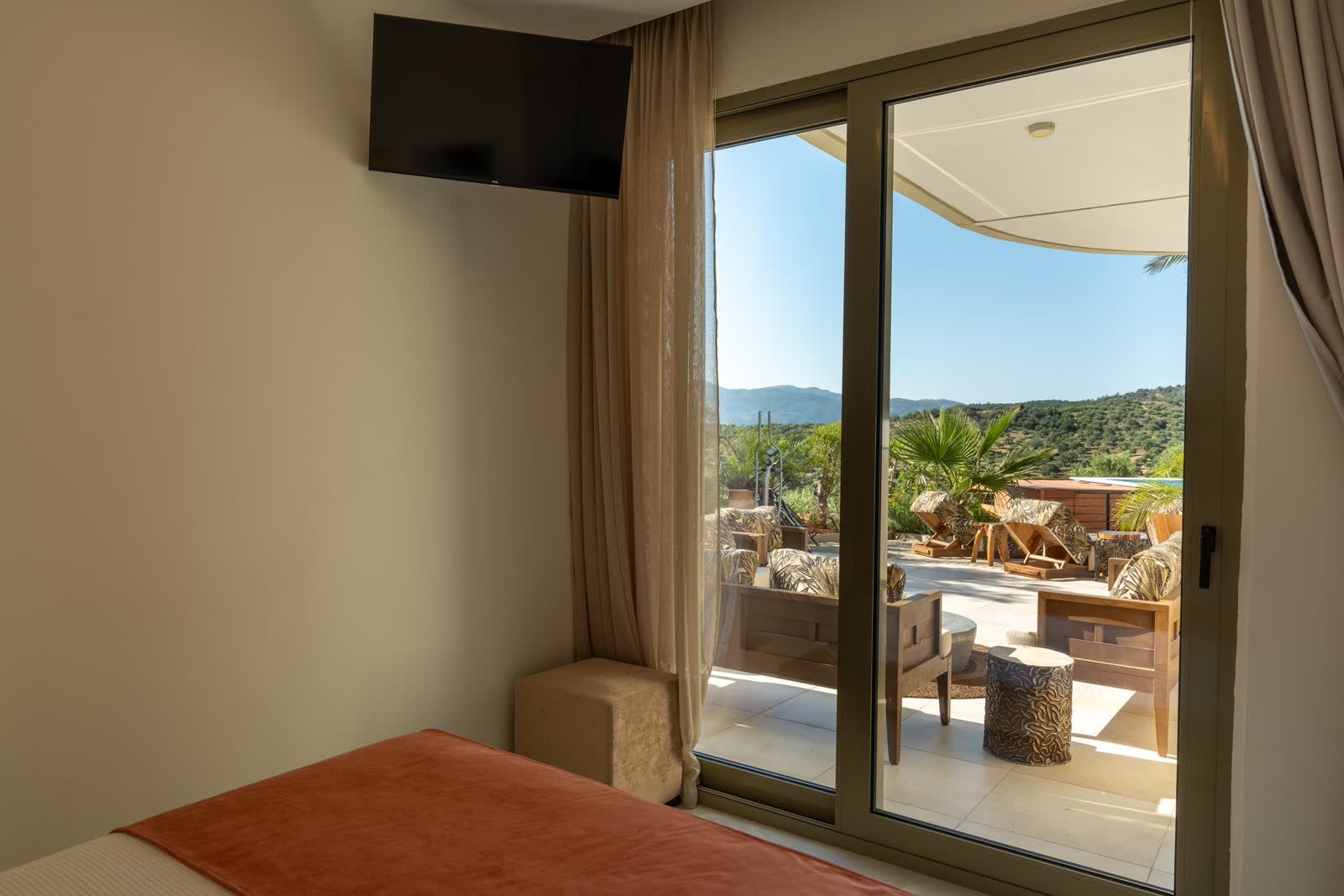 The garden bedroom doors open straight onto the sunny terrace