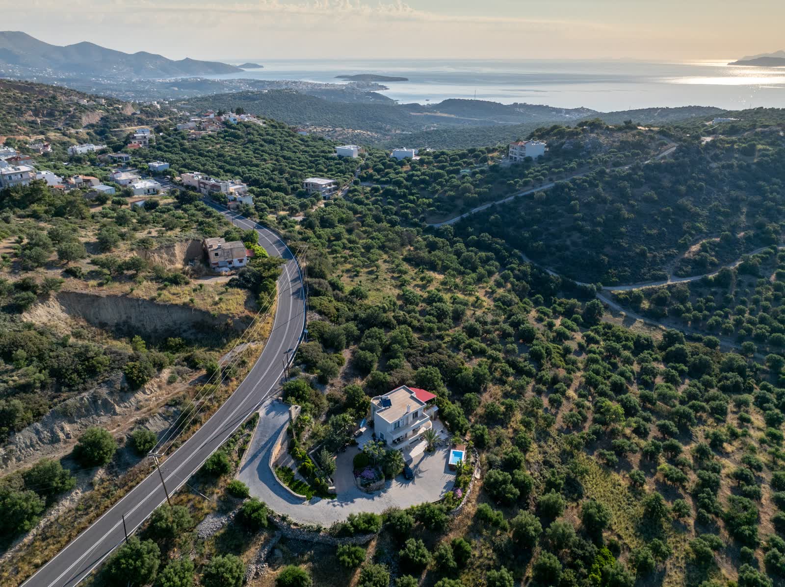 The road from the house winding down to Mirabello Bay